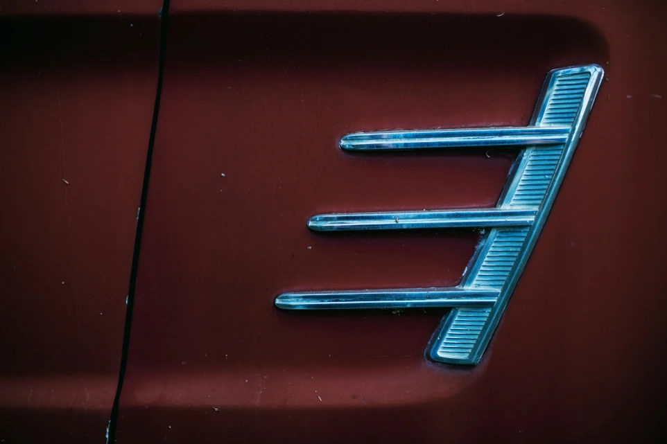 red car with silver grille